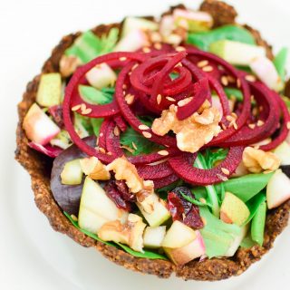 Enjoy a refreshing, plant-based beet and pear salad inside an Edible Walnut Shell Bowl made with California Walnuts! #ad