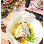 A picture of cannabis-infused fish backed in parchment paper.