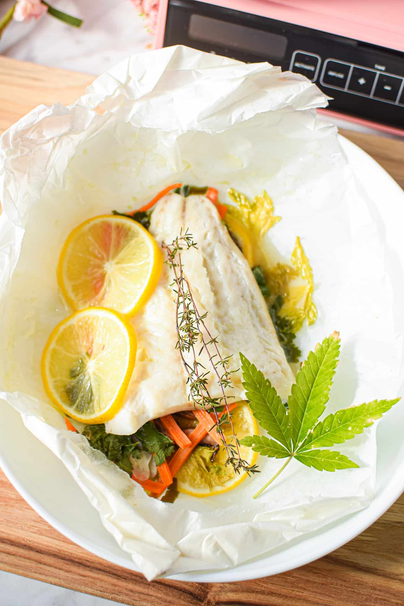 A picture of cannabis-infused fish backed in parchment paper. 