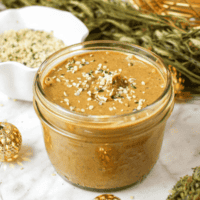 A picture of a mason jar full of homemade hemp seed butter.