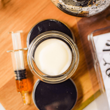 A picture of a container filled with cannabis infused lip balm.