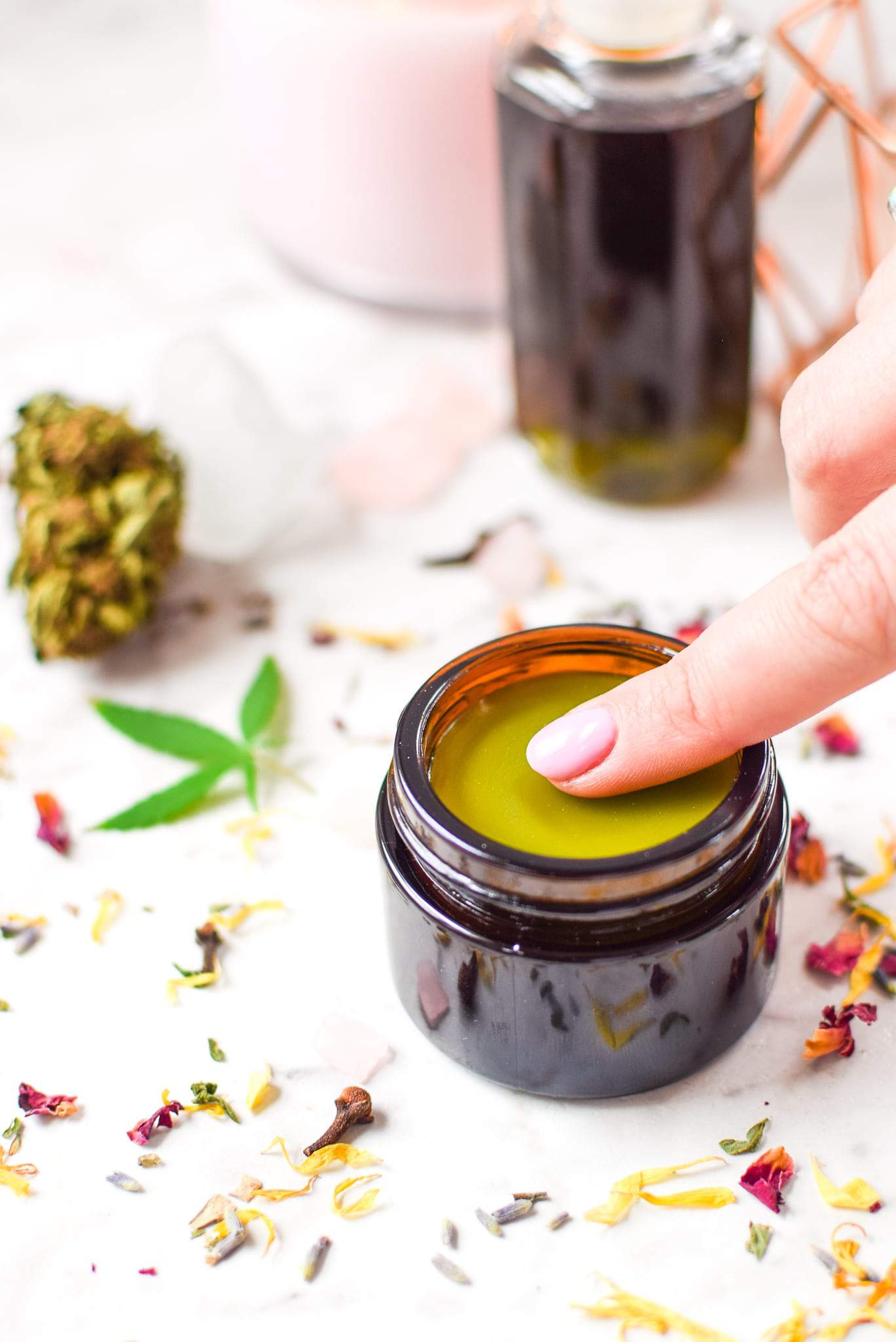 A picture of cannabis salve showing you how you can be cooking with CBD buds to make a topical. 