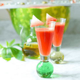 A picture of a shot glass with cannabis infused watermelon juice.