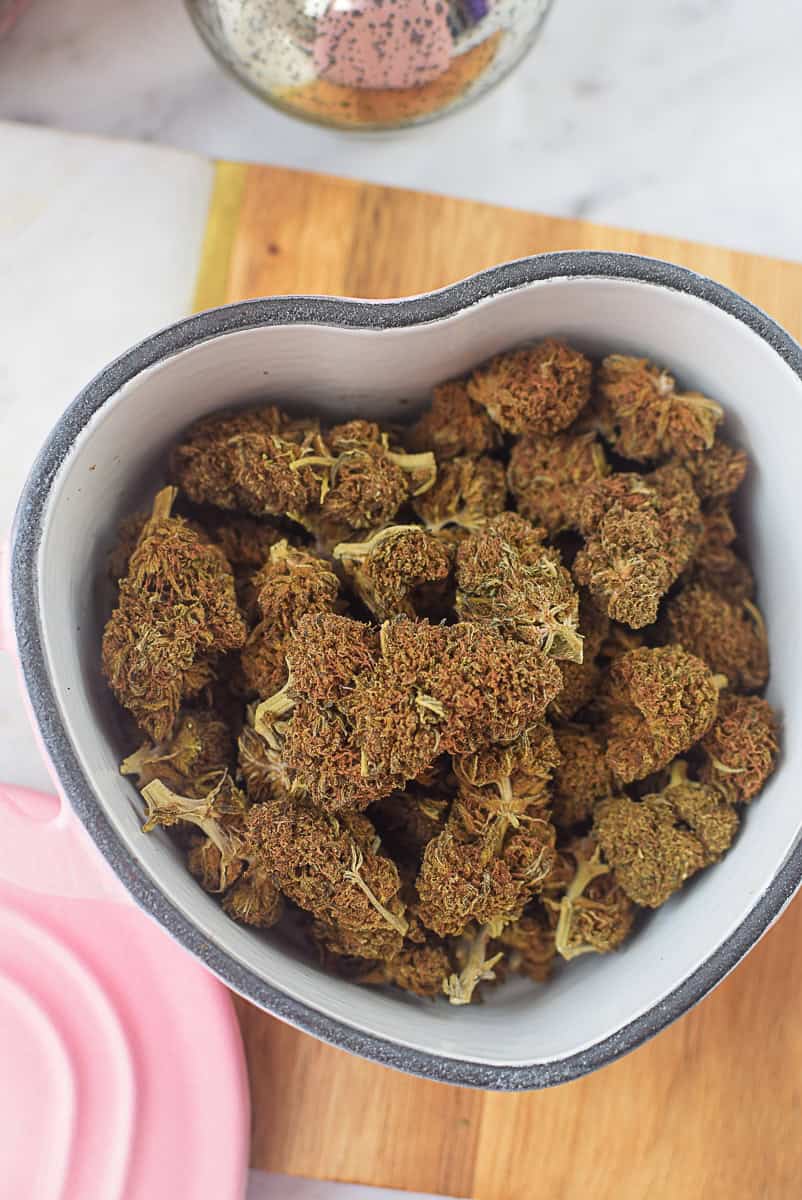 A picture of decarbed cannabis flower in an oven-safe baking dish.