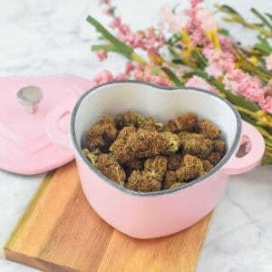 A picture of decarbed cannabis flower in an oven-safe baking dish.