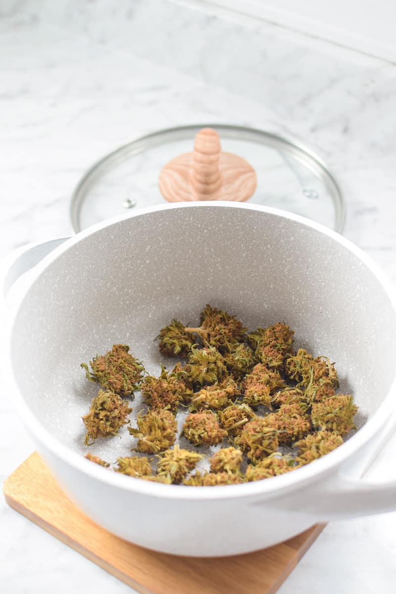 A picture of an oven-safe baking dish with decarboxylated cannabis inside.