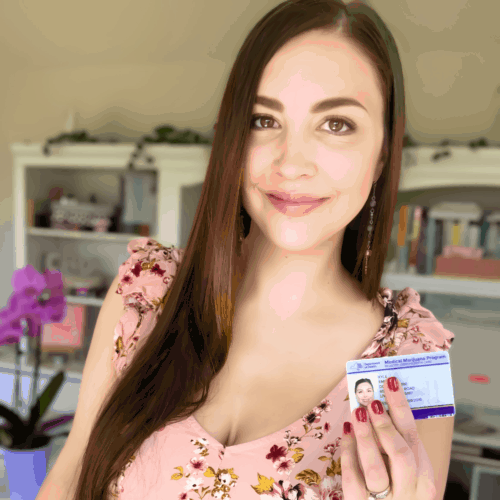 A picture of Emily Kyle holding a medical marijuana card.