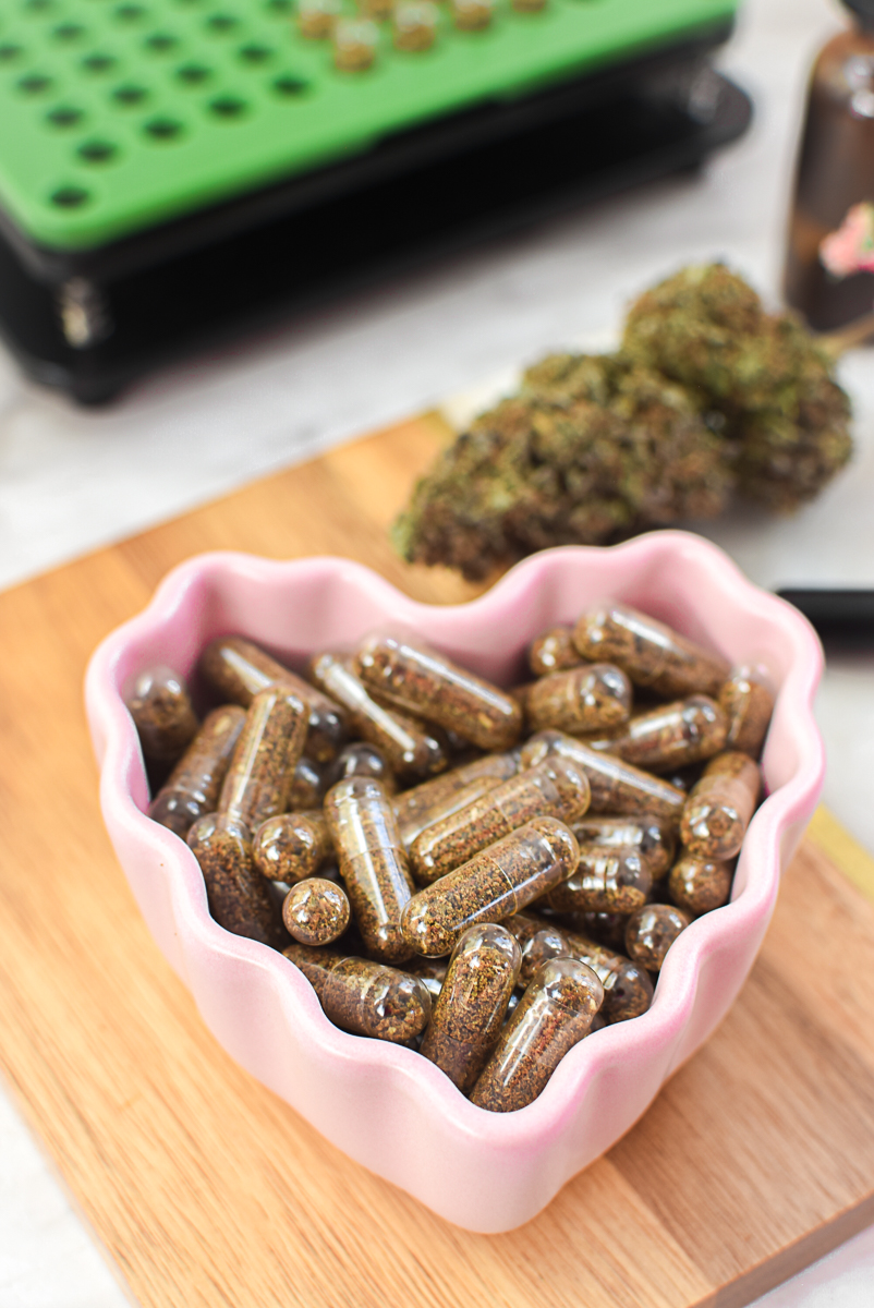 CBD Cannabis Capsules in Heart-Shaped Dish.