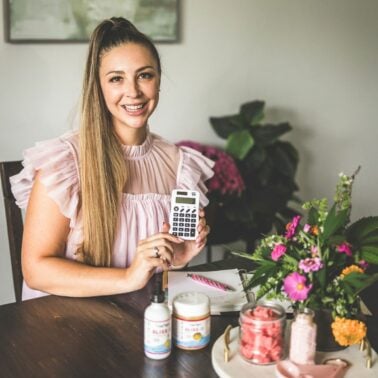 A picture of Emily Kyle with a calculator.