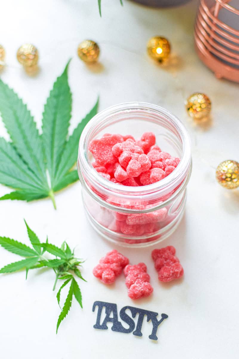 A picture of cannabis edibles with decor that says tasty.