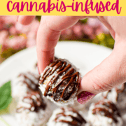 A white plate topped with several almond joy cannabis bliss balls garnished with a cannabis fan leaf