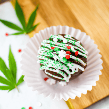 A final image shot of a cannabis hot cocoa bomb inside a white cupcake liner