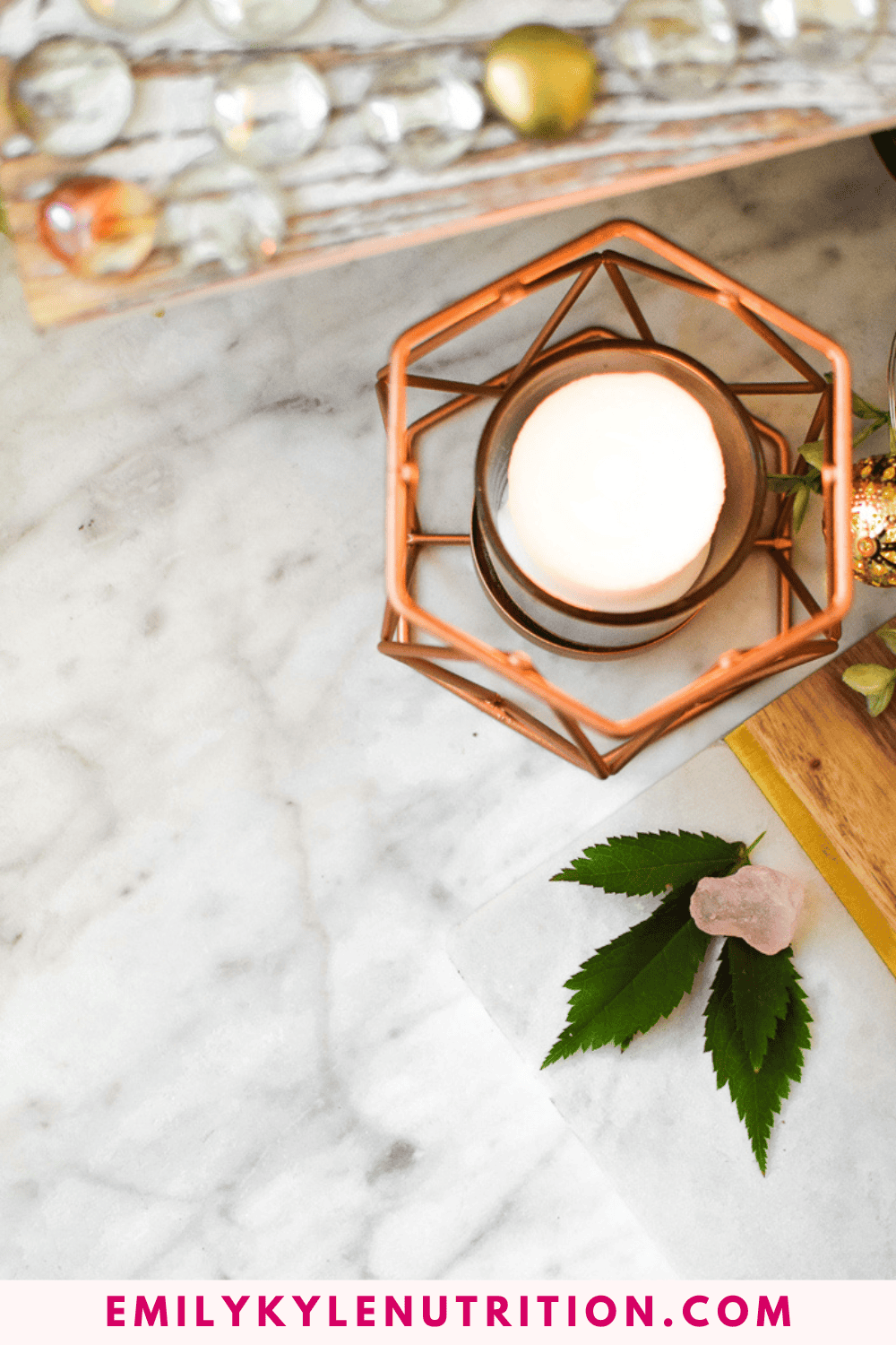 A picture of a candle and a leaf.