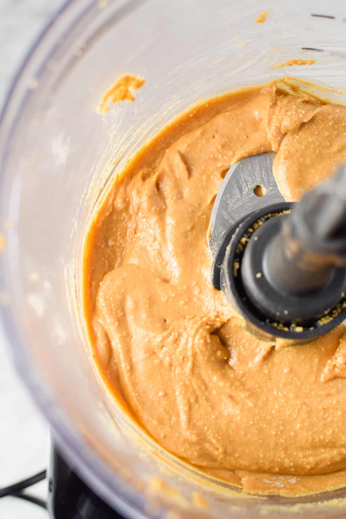 A food processor full of freshly made cannabis peanut butter