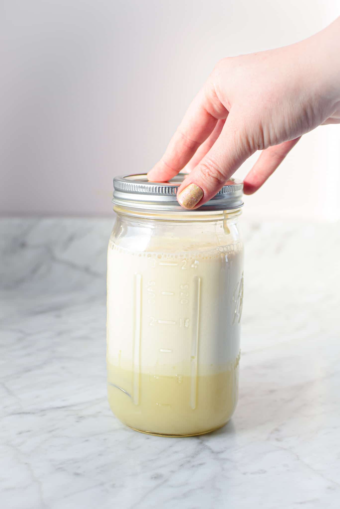 A picture of a mason jar full of cannabis coffee creamer. 