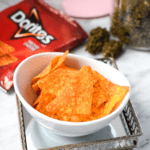 A white bowl filled with cannabis infused Doritos aka doweedos.