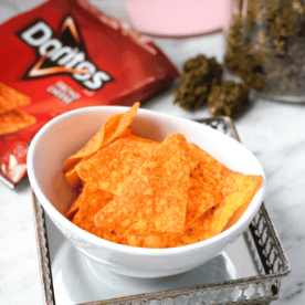 A white bowl filled with cannabis infused Doritos aka doweedos.