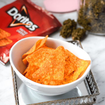 A white bowl filled with cannabis infused Doritos aka doweedos.