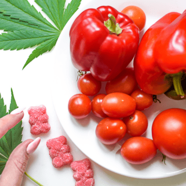 A picture of cannabis gummies and grape tomatoes.