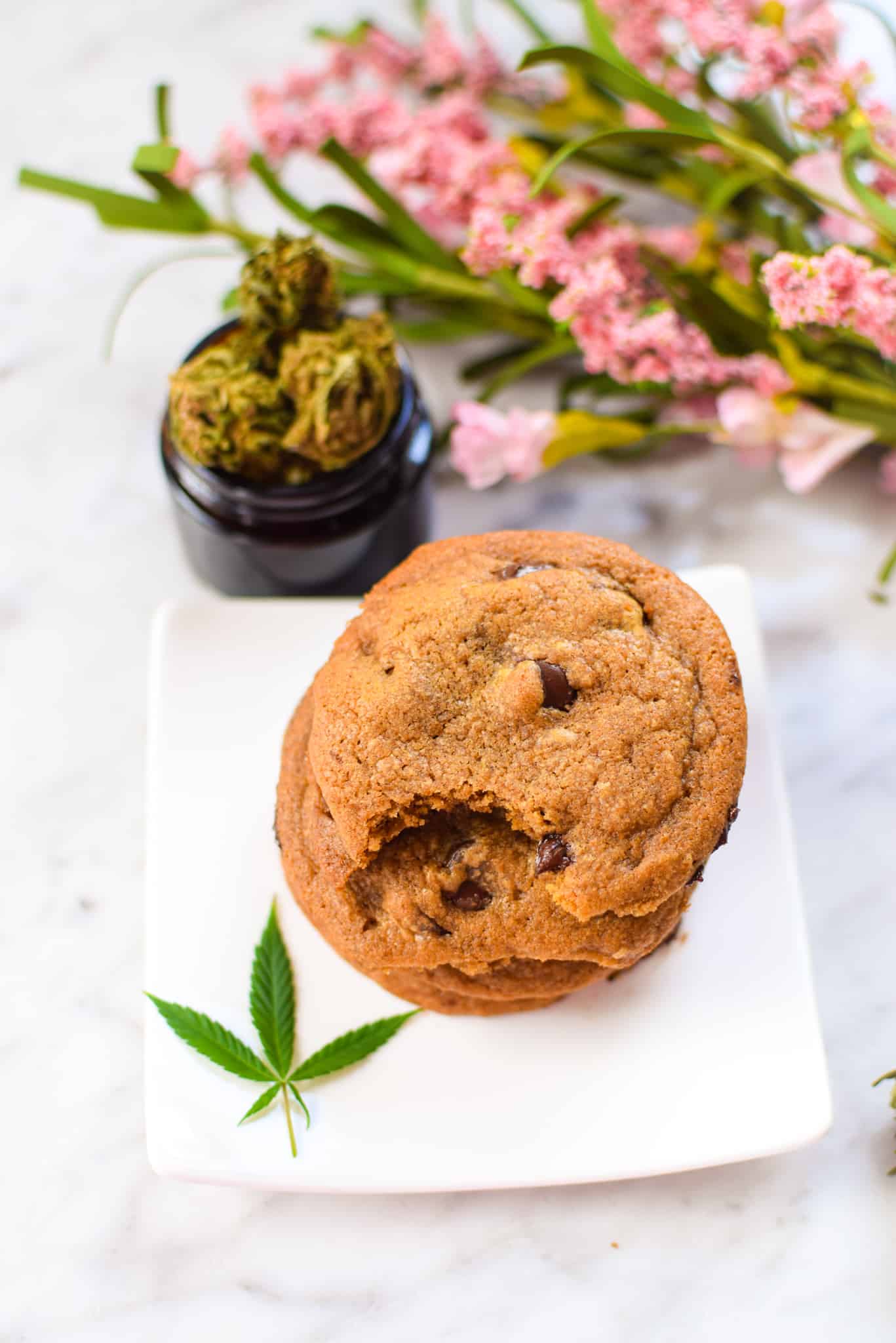 A picture of CBD chocolate chip cookies on a white plate. 
