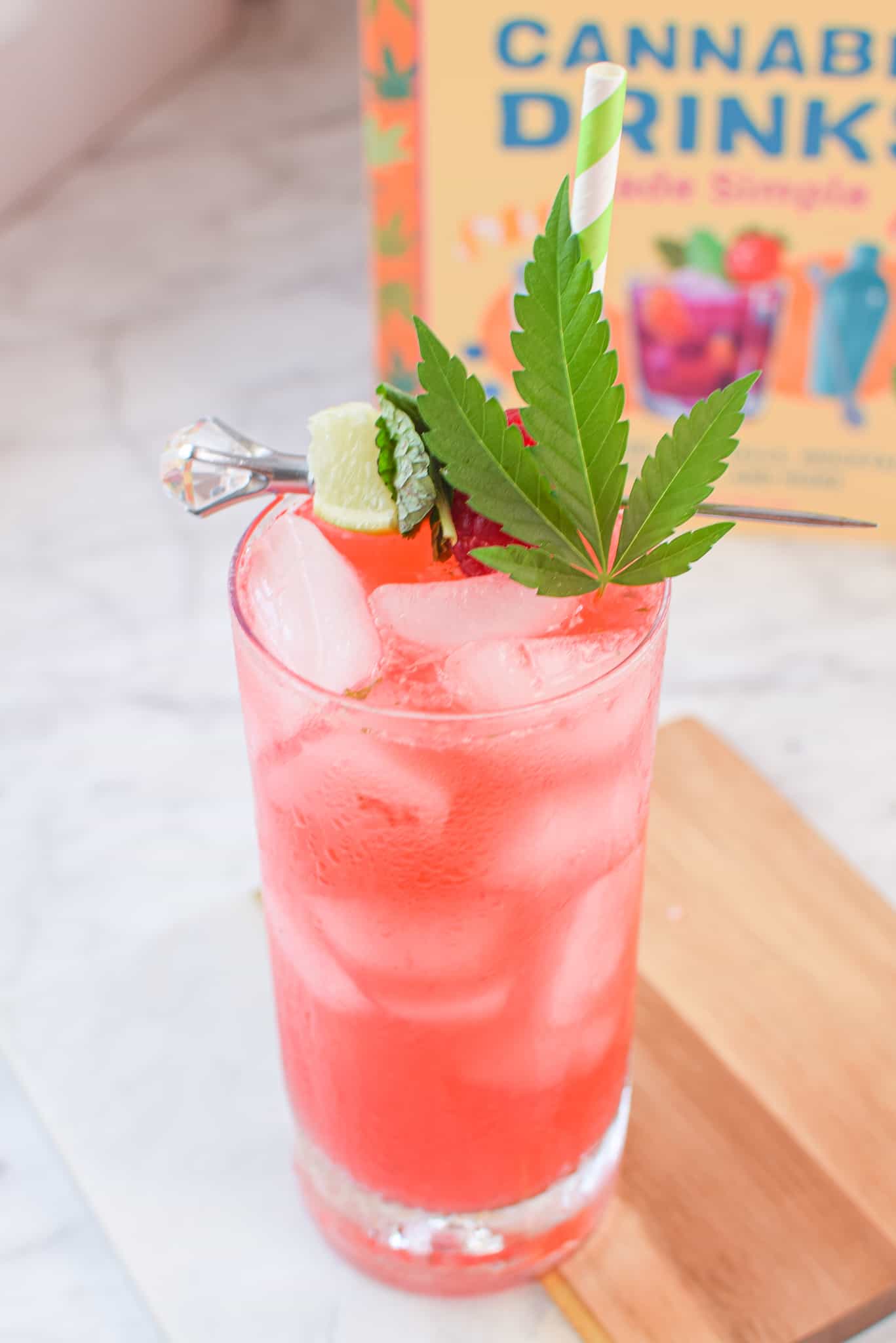 A picture of a raspberry cannabis mojito.