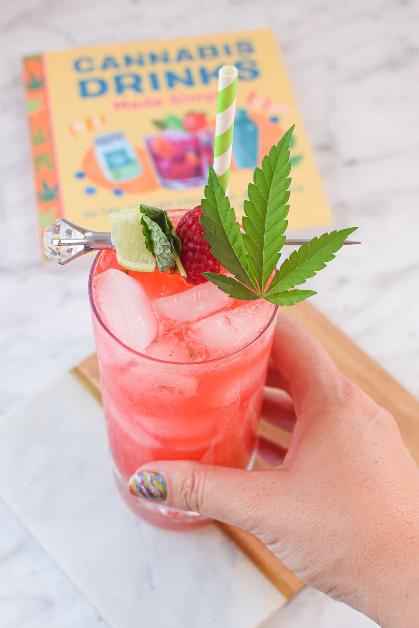 A picture of a raspberry cannabis mojito.