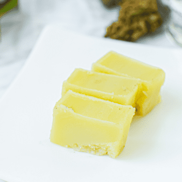 A picture of CBD butter or CBD cannabutter on a white plate.