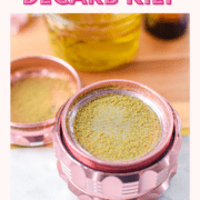 A picture of cannabis kief in a pink grinder.