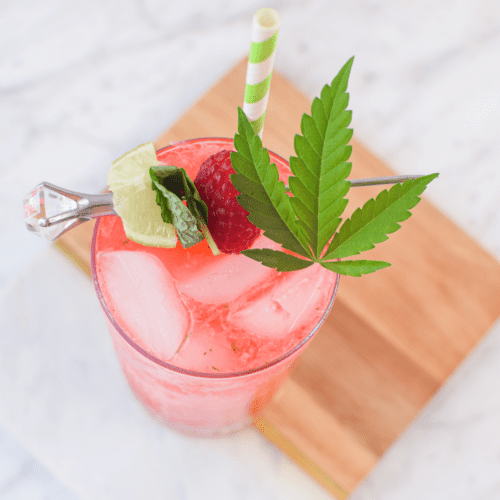 A picture of a raspberry cannabis mojito.