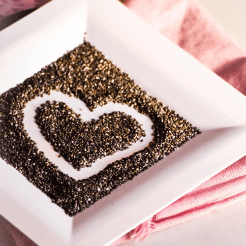 A plate of chia seed with a heart drawn in the middle.