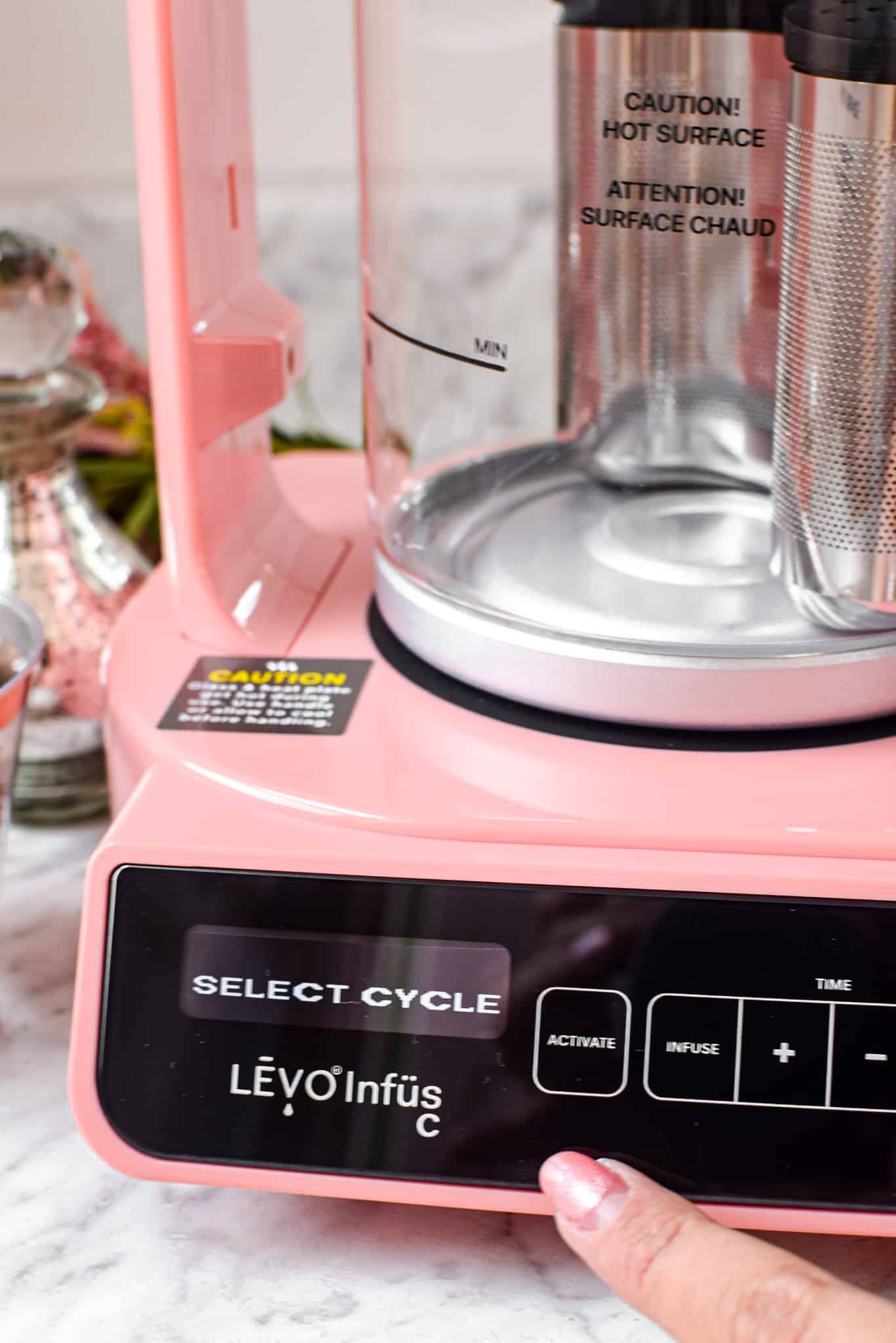 A picture of a pink LEVO machine.