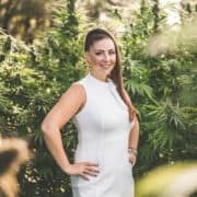 A picture of Emily Kyle in a cannabis garden.