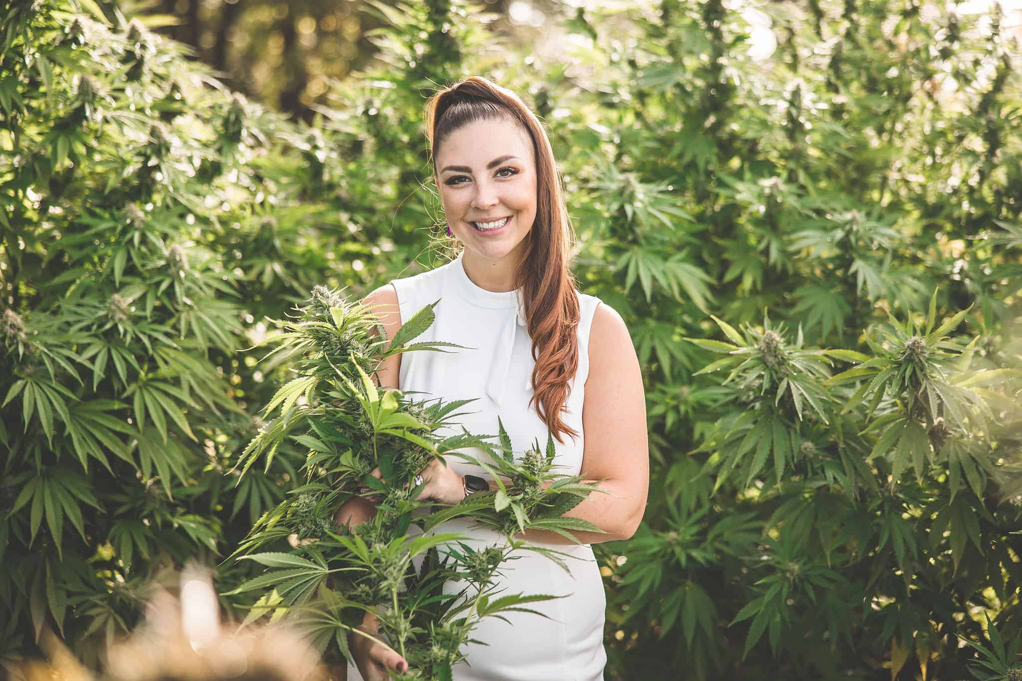 A picture of Emily Kyle in a cannabis garden.