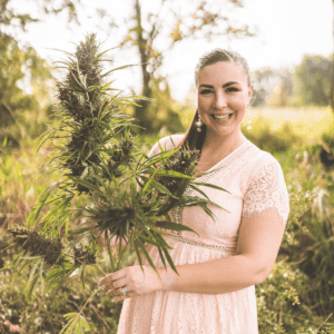 A picture of Emily Kyle holding cannabis.
