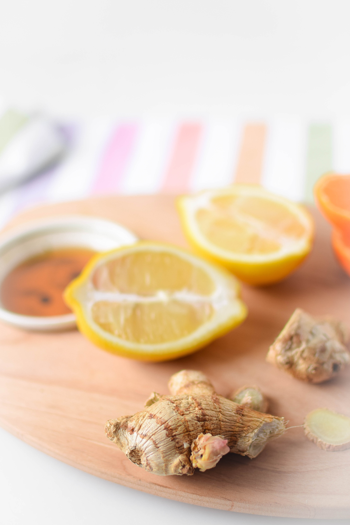 The ingredients needed to make honey, ginger, warm lemon water.