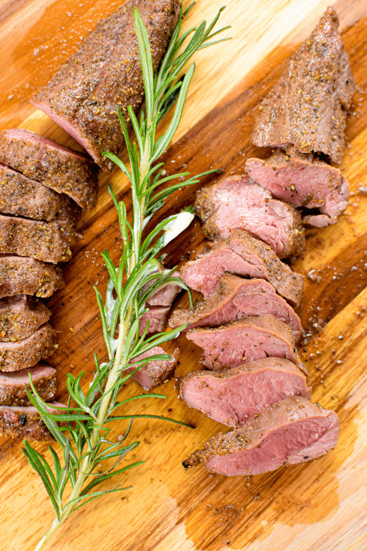 A picture of a grilled and sliced steak with cannabutter.