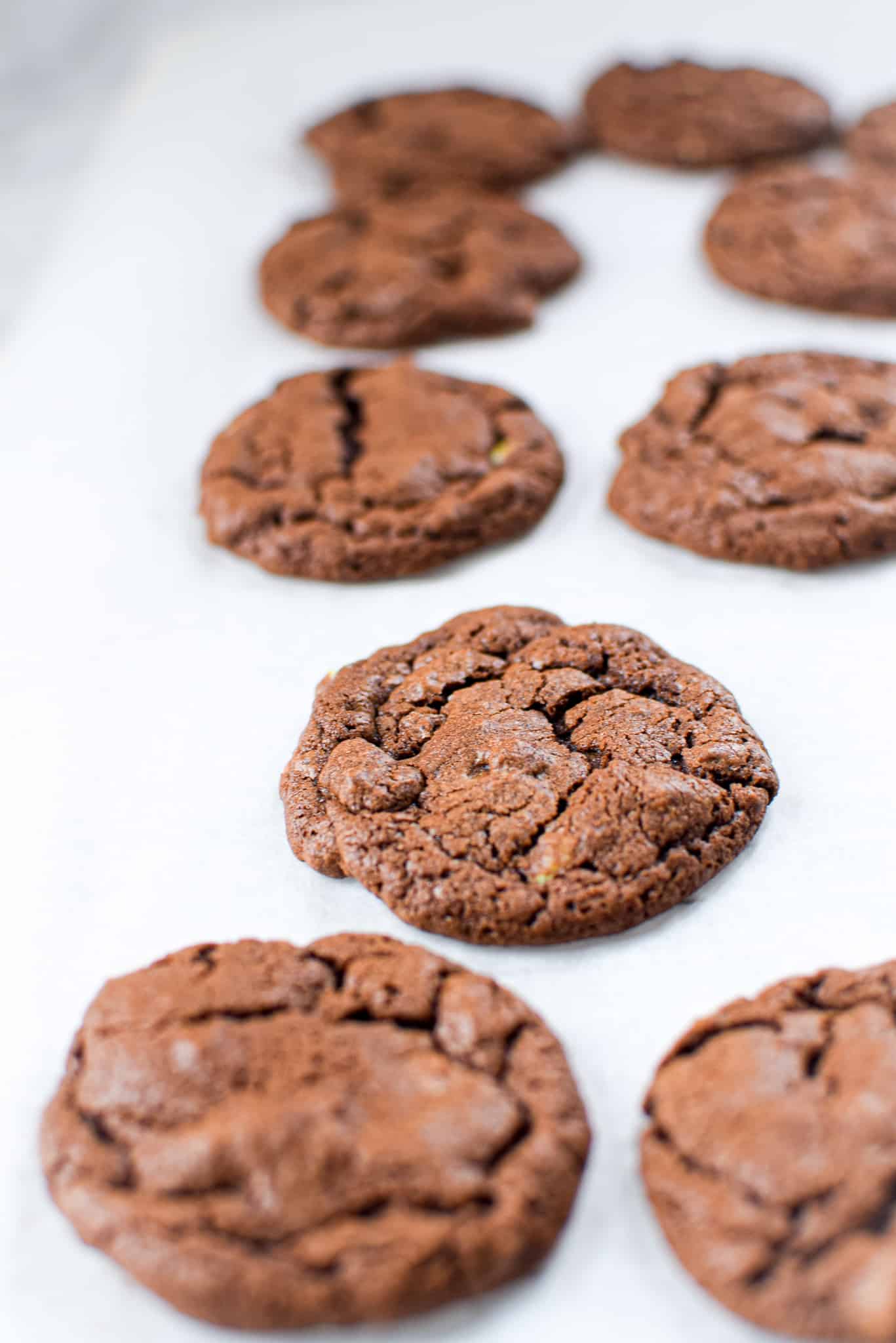 A picture of a chocolate mint cannabis cookie with a bite taken out.