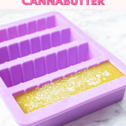 A picture of cannabutter made on the stovetop poured into purple silicone stick molds.