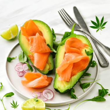 A picture of avocado with salmon and a cannabis leaf.