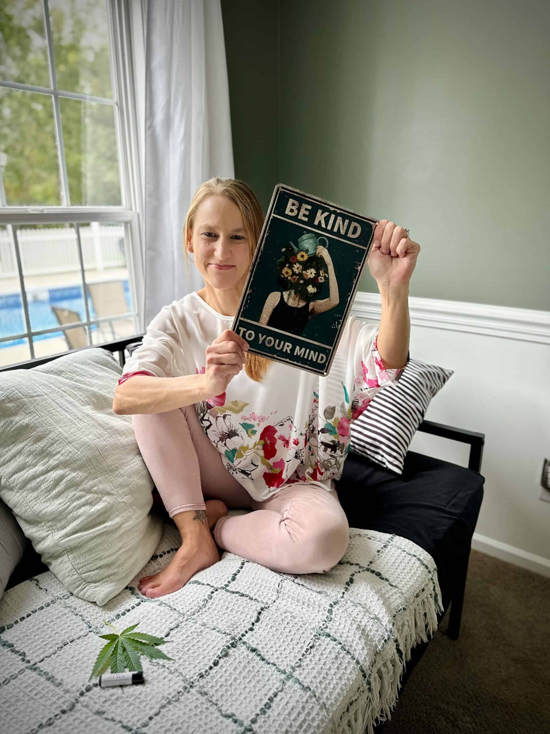 Photo of Renee Leonard with Be Kind To Your Mind sign