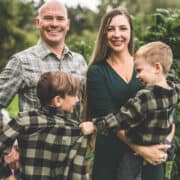 A picture of Emily Kyle and her family in a cannabis garden.