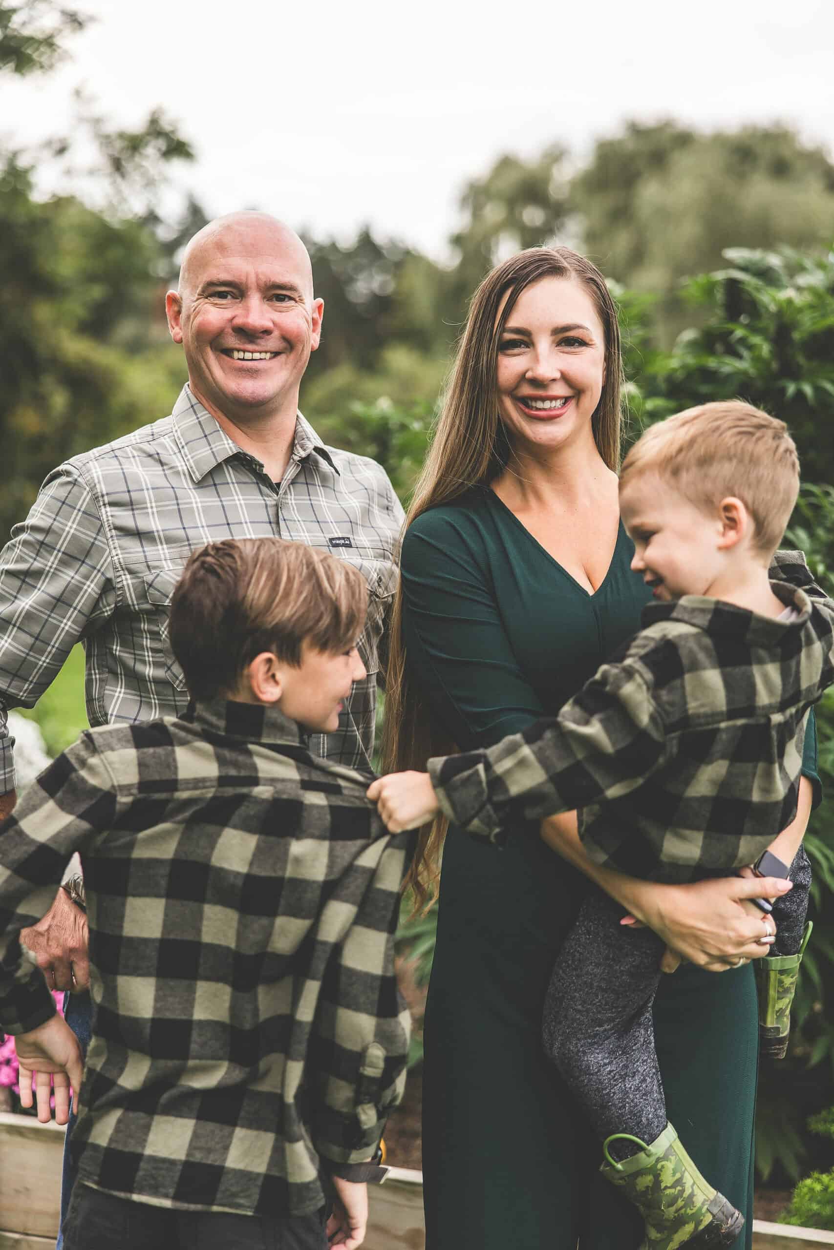 A picture of Emily Kyle and her family in a cannabis garden.