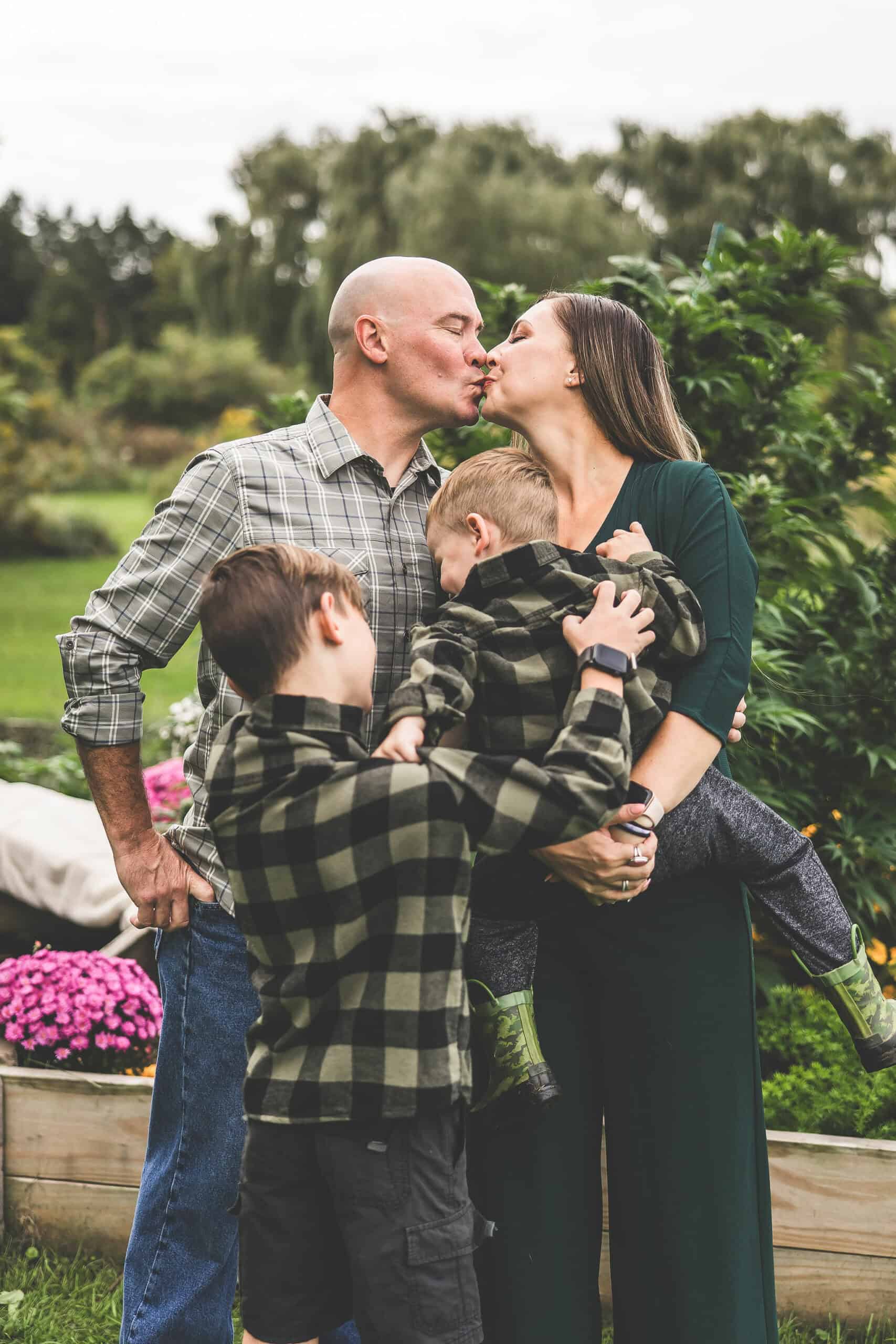 A picture of Emily Kyle and her family in a cannabis garden.