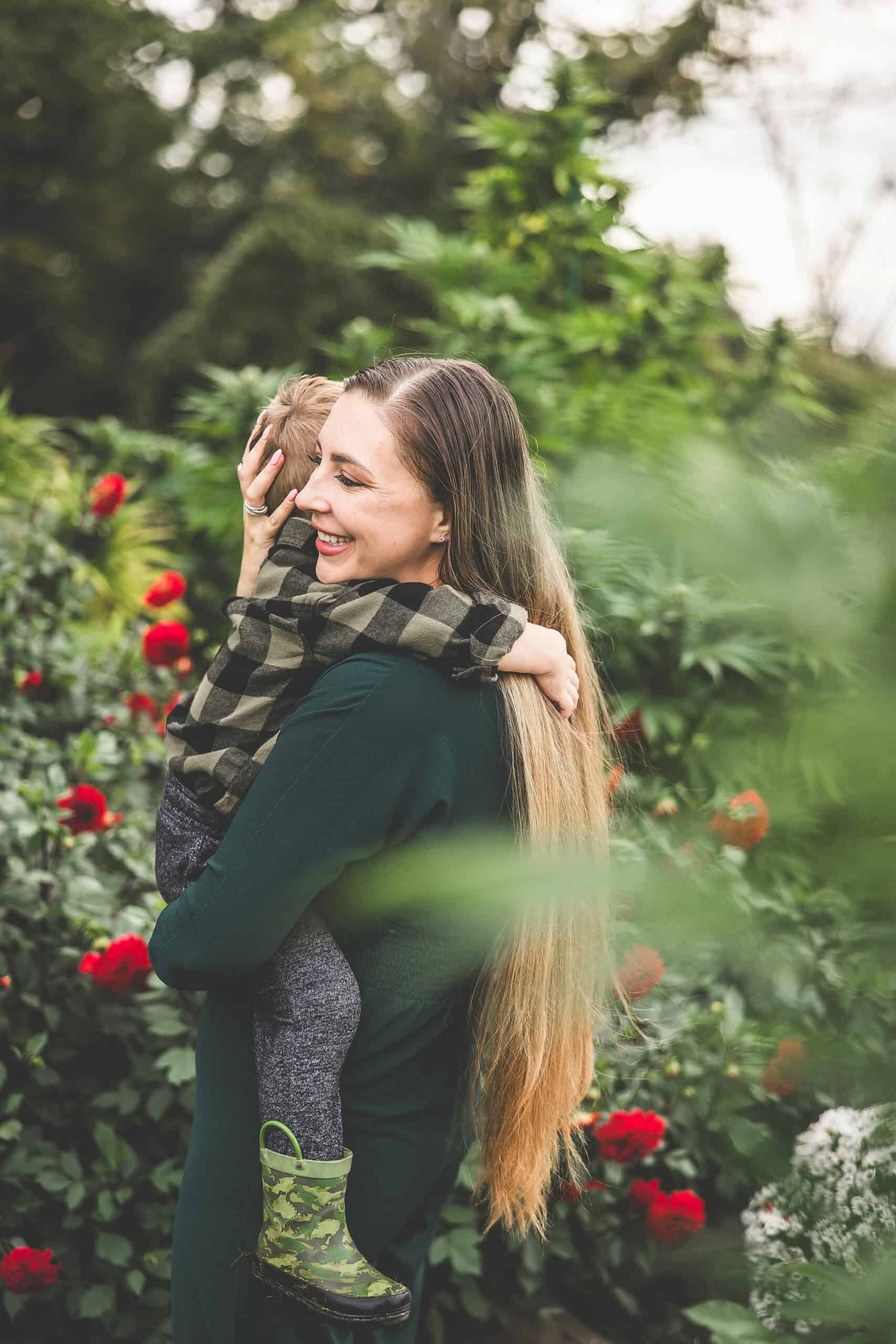 A picture of Emily Kyle and her family in a cannabis garden.