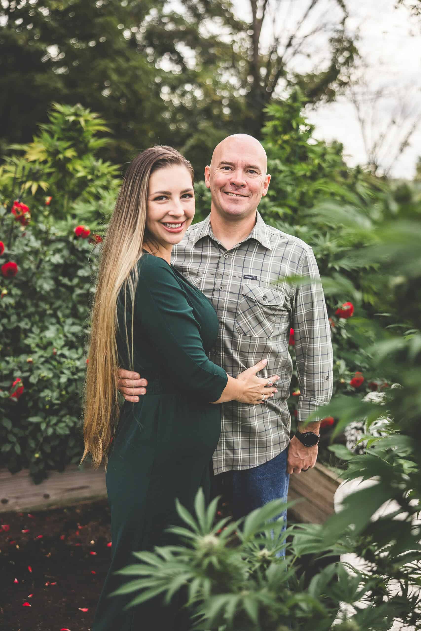 A picture of Emily Kyle and her family in a cannabis garden.