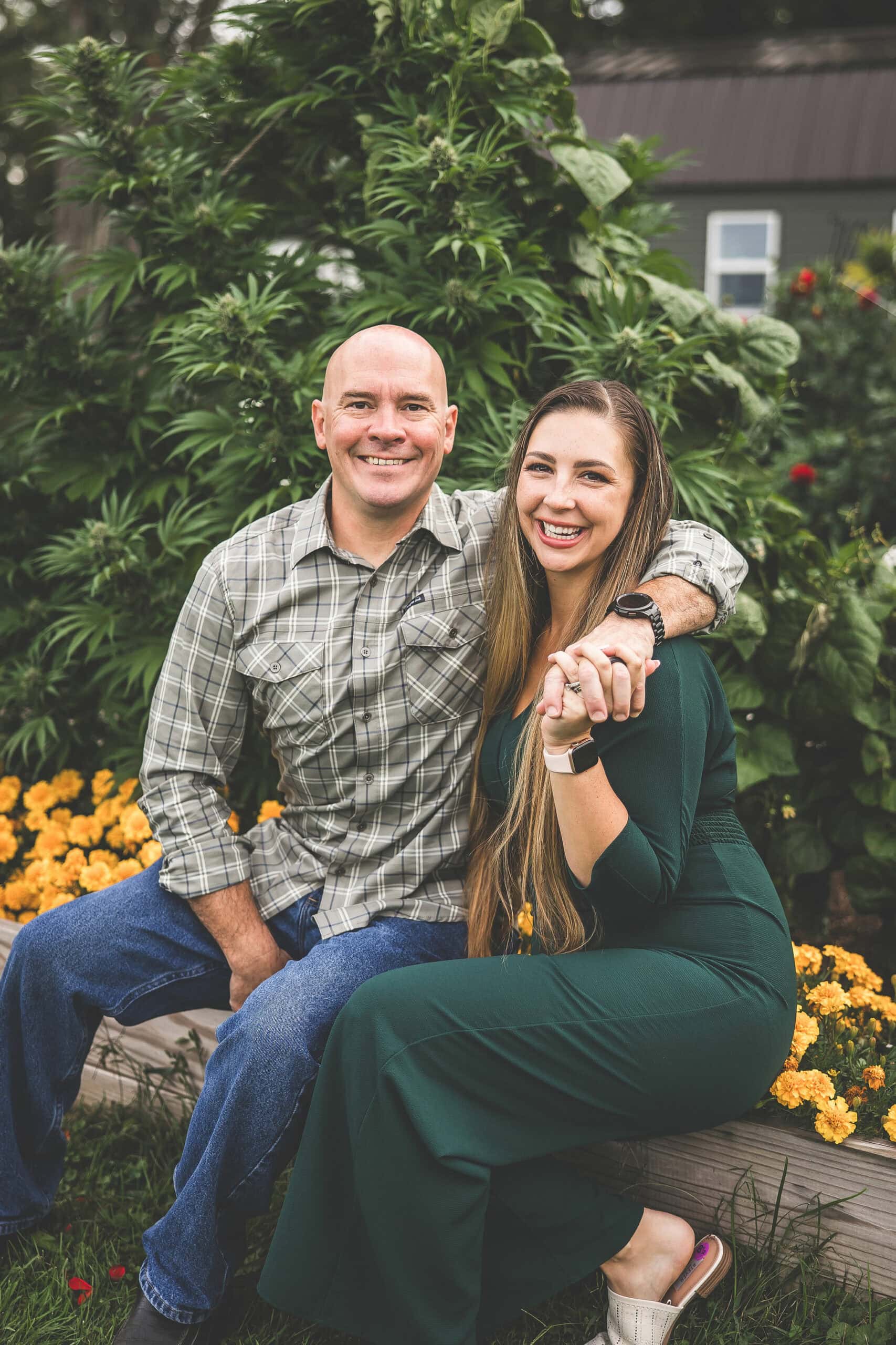 A picture of Emily Kyle and her family in a cannabis garden.