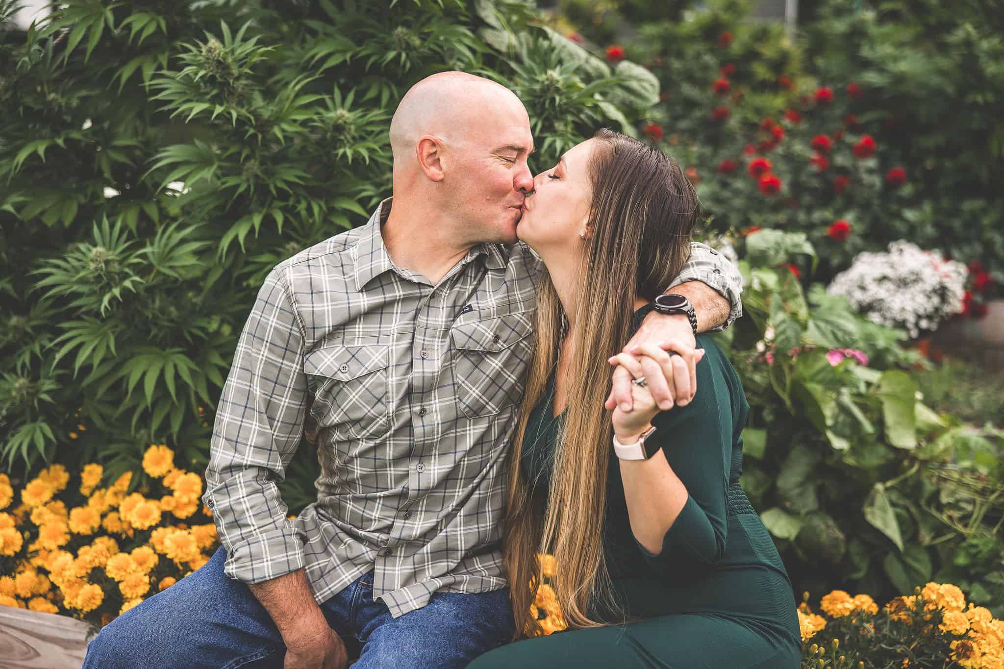 A picture of Emily Kyle and her family in a cannabis garden.