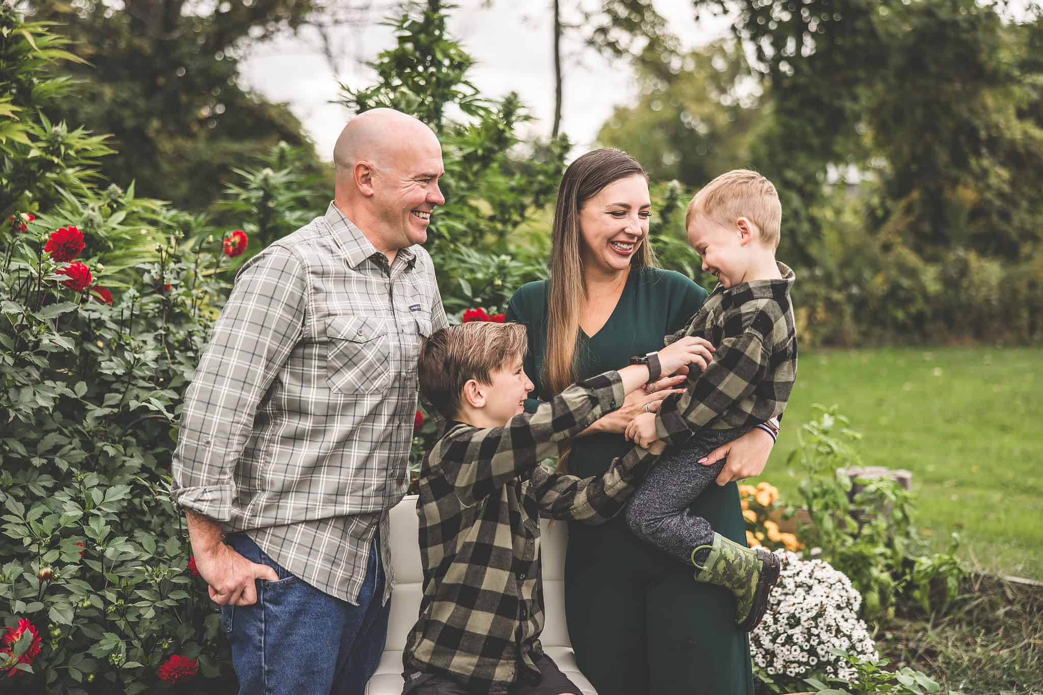 A picture of Emily Kyle and her family in a cannabis garden.