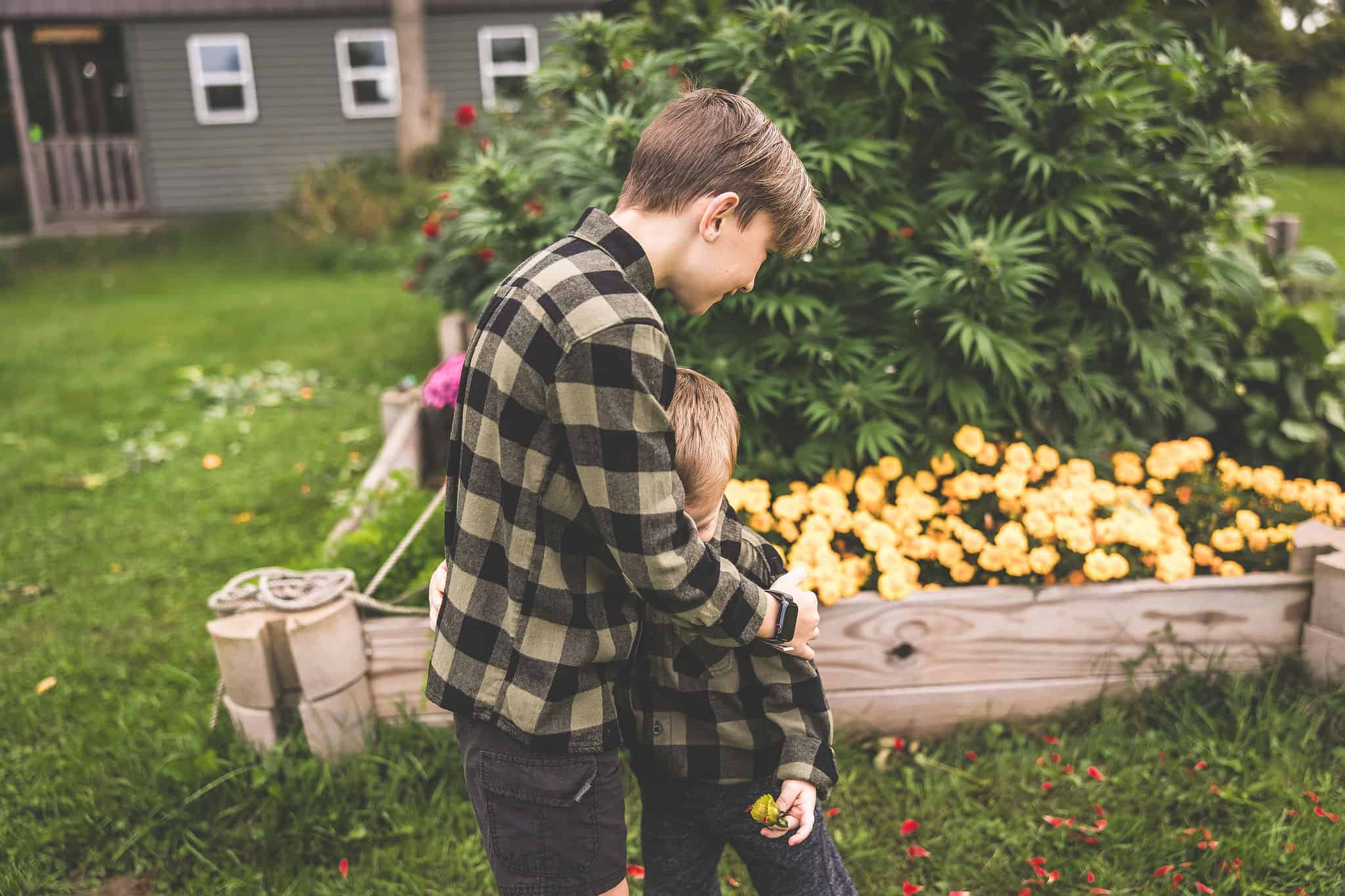 A picture of Emily Kyle and her family in a cannabis garden.