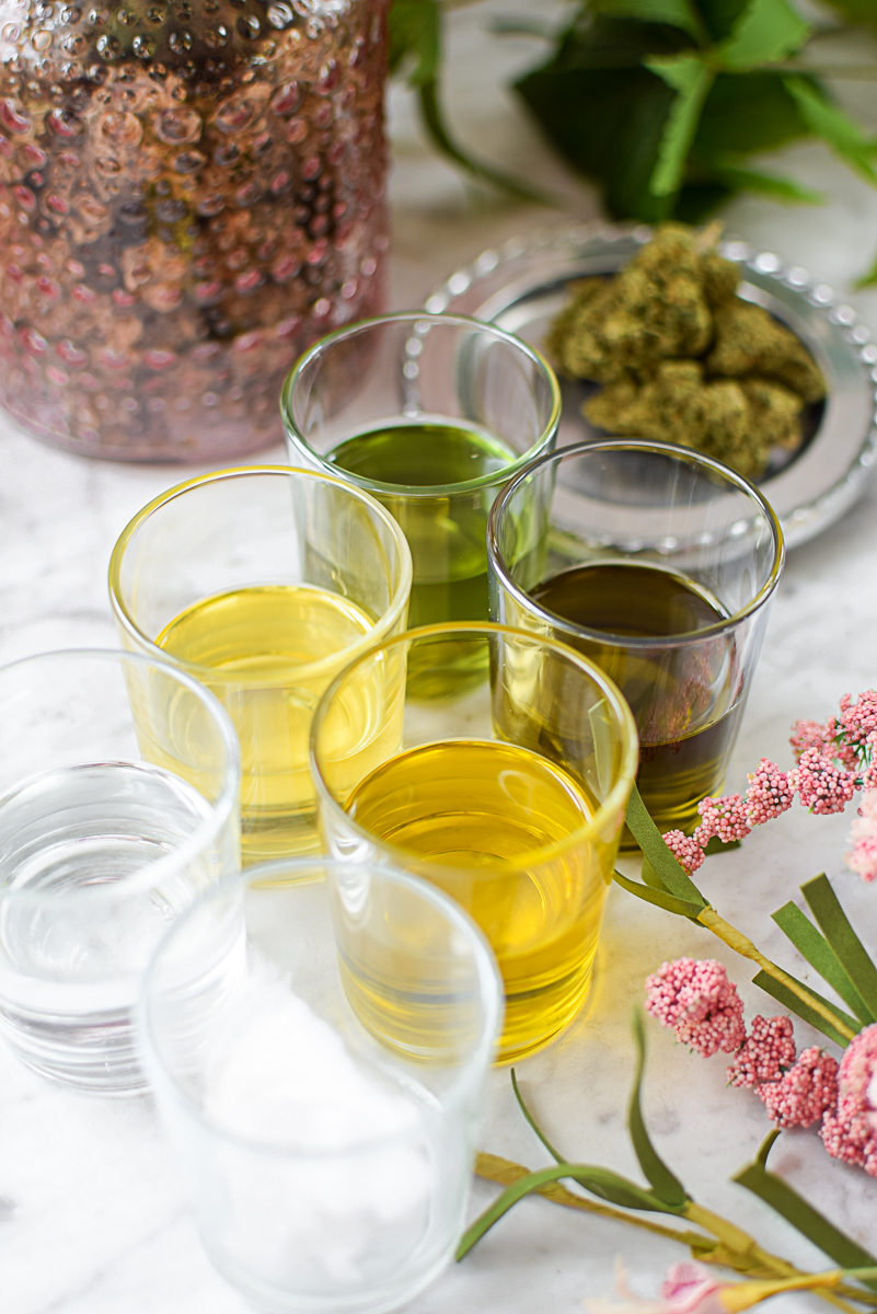 A picture of several different types o cannabis oil.
